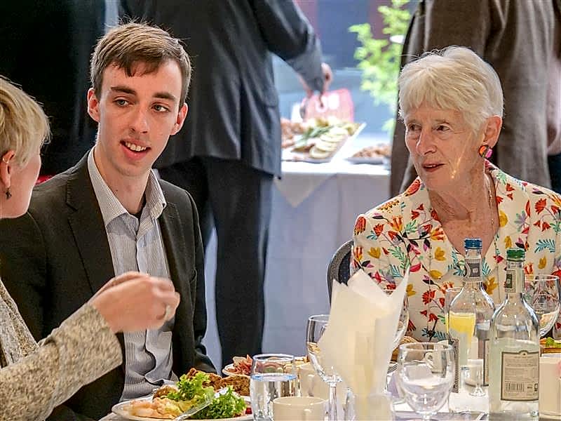 Jean Oglesby (right) meets with students and staff at the RNCM