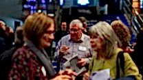 Alumni socialise on the RNCM concourse.